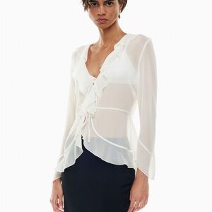 white sheer ruffled Wilfed long-sleeve blouse.